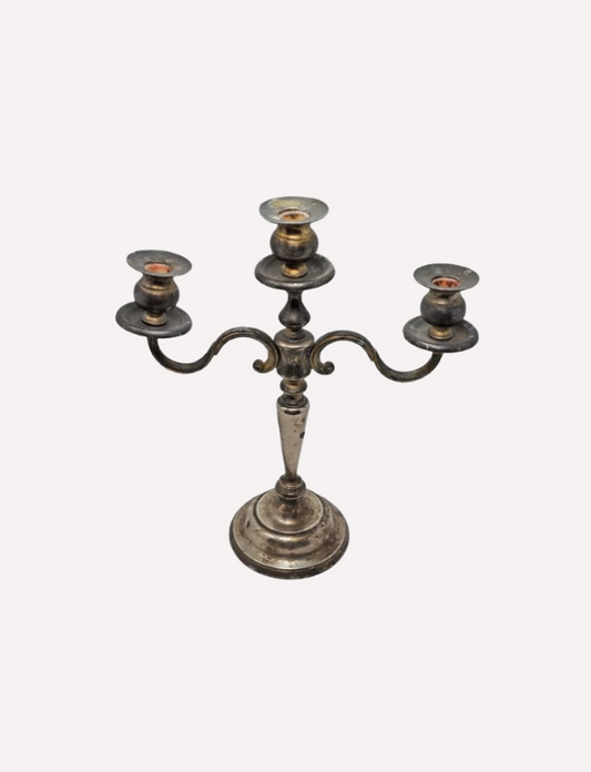 This is an 19th Century candle stand, made of brass